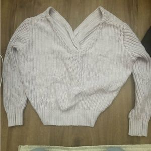 Purple sweater with a tie back detail